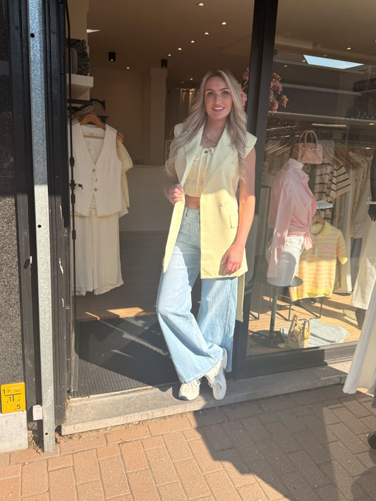 Mouwloze blazer pastel geel